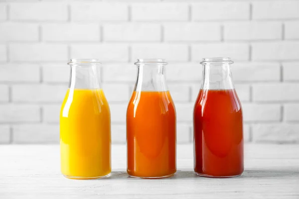 Delicious juices in bottles — Stock Photo, Image