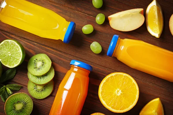 Delicious juices in bottles — Stock Photo, Image