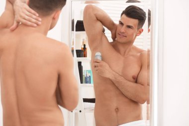 man using deodorant clipart