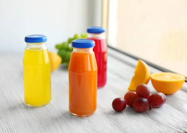 Delicious juices in bottles — Stock Photo, Image