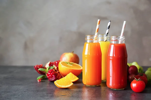 Delicious juices in bottles — Stock Photo, Image