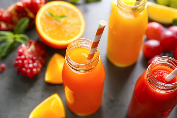 Delicious juices in bottles — Stock Photo, Image