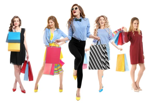 Beautiful women with shopping bags on white background — Stock Photo, Image