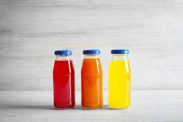 Delicious juices in bottles — Stock Photo, Image