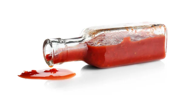 Bottle with spilled tomato sauce — Stock Photo, Image