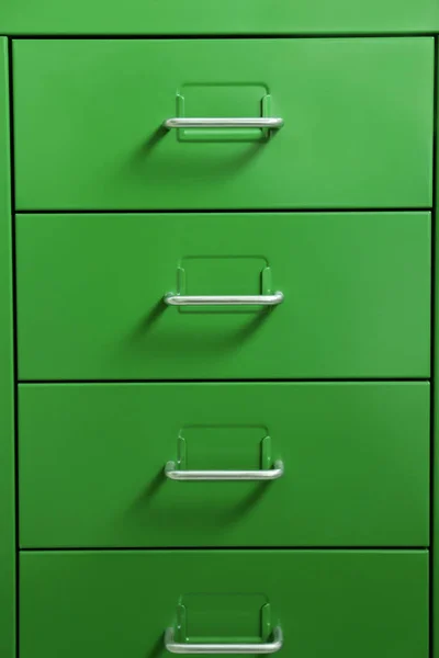 Green cabinet with metal handles — Stock Photo, Image