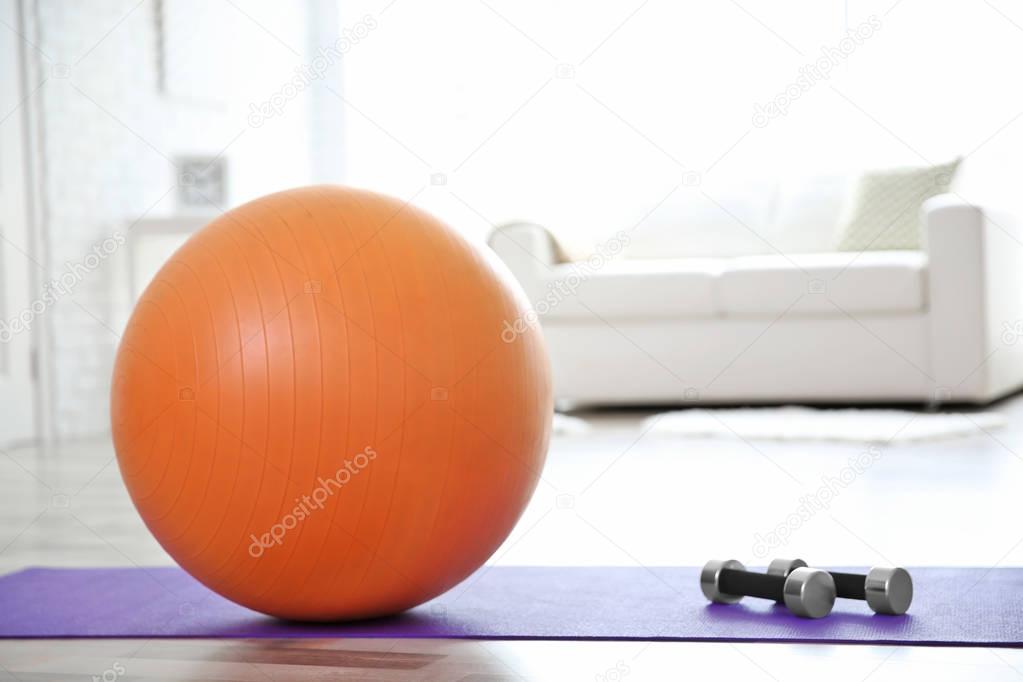 Rubber ball and dumbbells