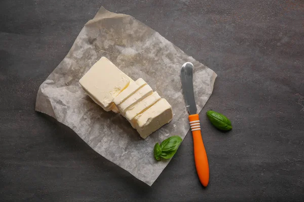 Food paper with sliced butter — Stock Photo, Image