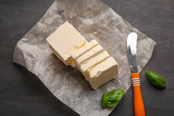 Food paper with sliced butter — Stock Photo, Image