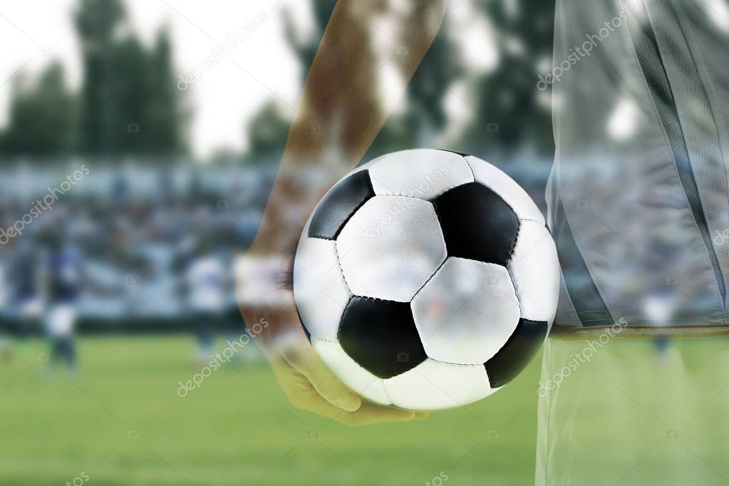 Double exposure of professional football player with ball and stadium