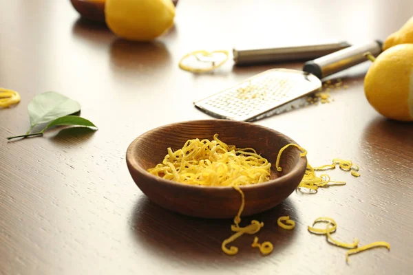 Bowl with fresh zest of lemon — Stock Photo, Image