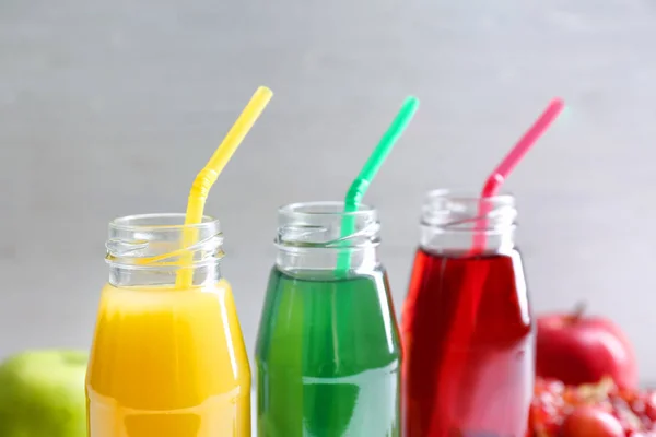 Delicious juices in bottles — Stock Photo, Image