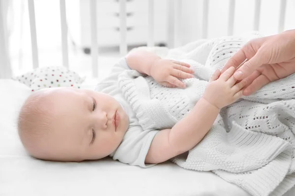 Cute baby lying in cradle — Stock Photo, Image