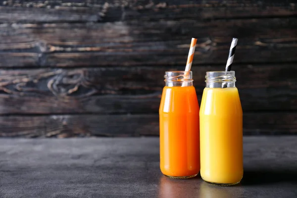 Delicious juices in bottles — Stock Photo, Image