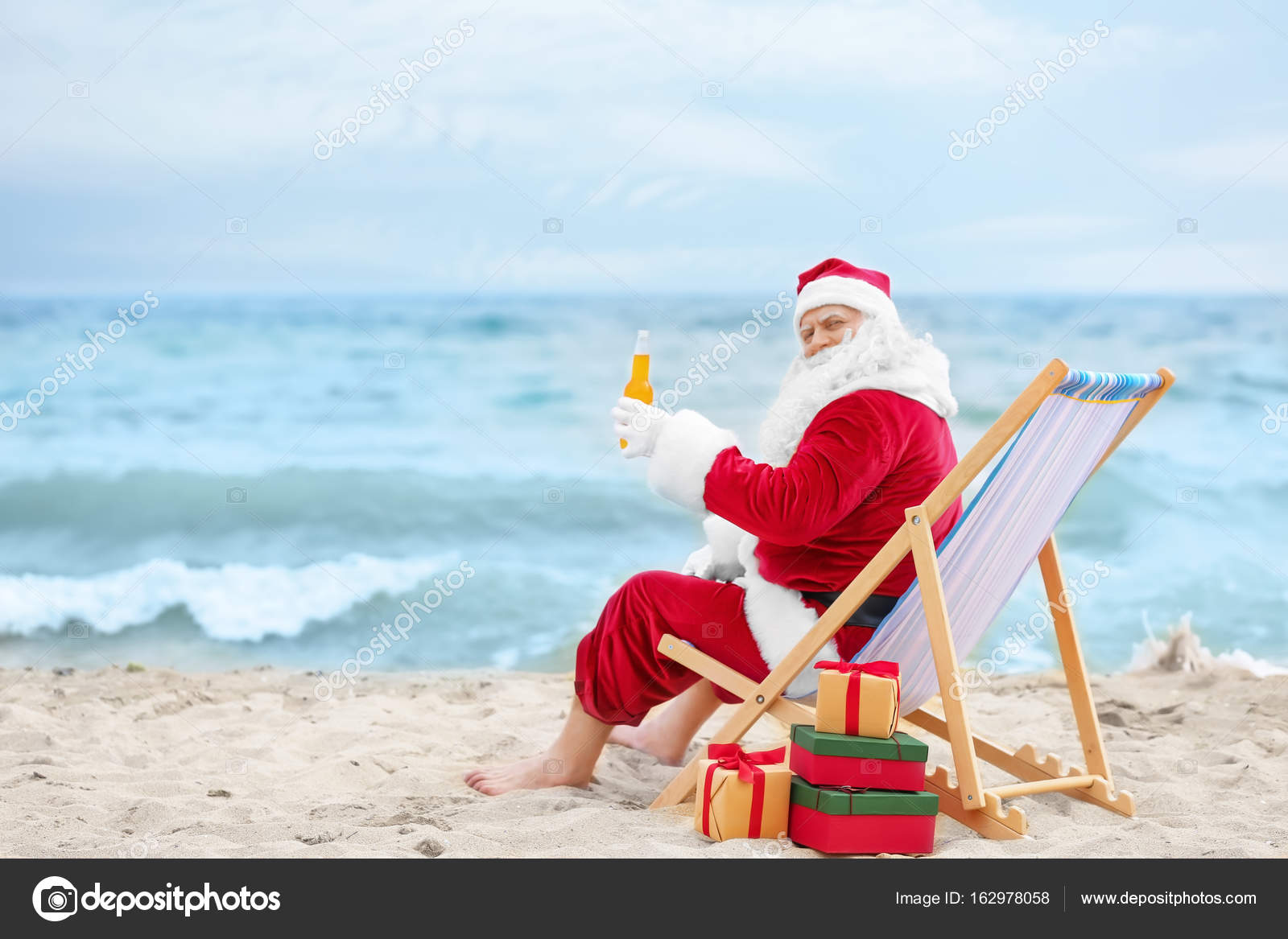 Authentic Santa Claus With Bottle Of Drink Relaxing In Deck Chair On Beach Stock Photo By C Belchonock 162978058