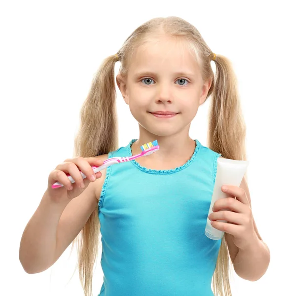 Linda chica con cepillo de dientes y pegar sobre fondo blanco. Concepto de limpieza dental —  Fotos de Stock