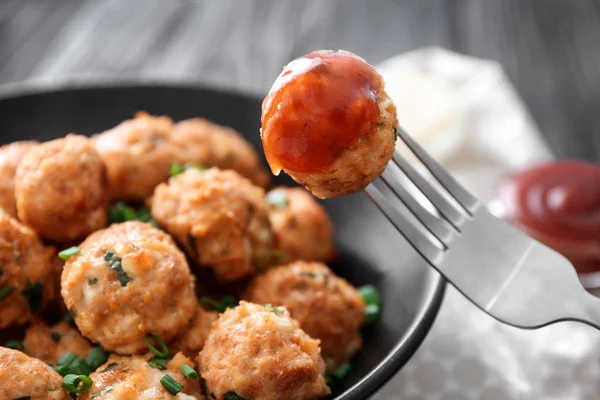 Fork and plate with delicious turkey meatballs on table, closeup — Stock Photo, Image