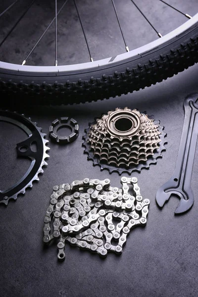 Bicycle parts and tool on gray background — Stock Photo, Image