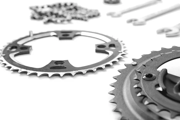 Bicycle parts and repair tools on white background — Stock Photo, Image