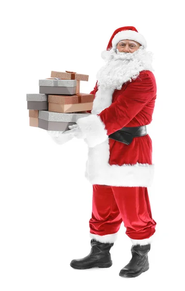 Happy authentic Santa Claus holding a pile of gift boxes on white background — Stock Photo, Image