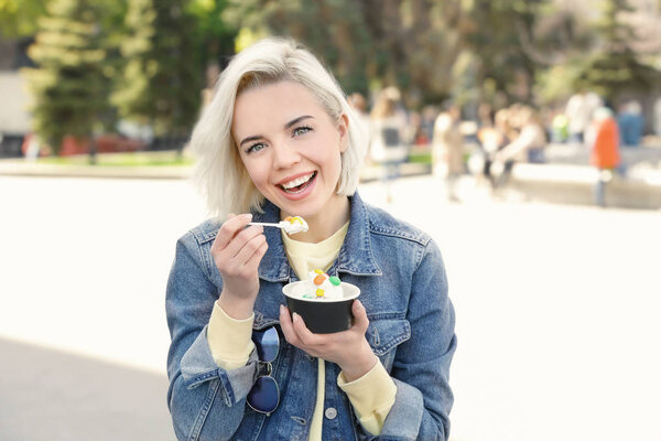 young woman eating ice cream 
