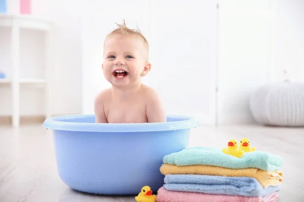 Little baby boy washing in bath basin at home — Stock Photo, Image