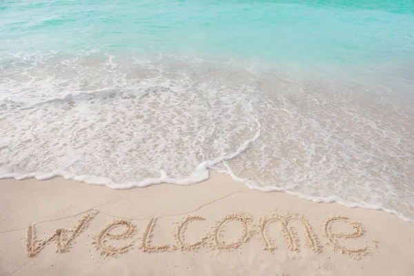 Word WELCOME on beach sand — Stock Photo, Image