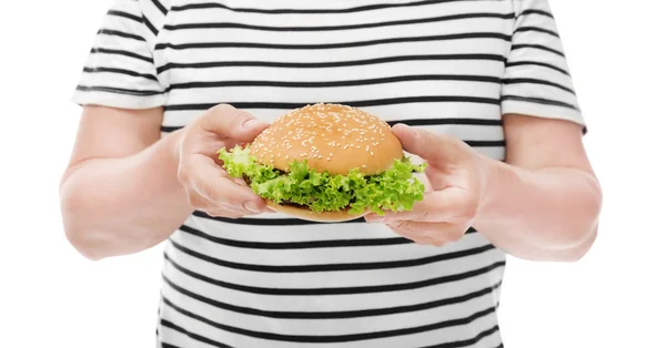 Overweight man with burger on white background. Diet concept — Stock Photo, Image