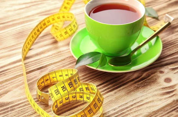 stock image Cup of tea and measuring tape 