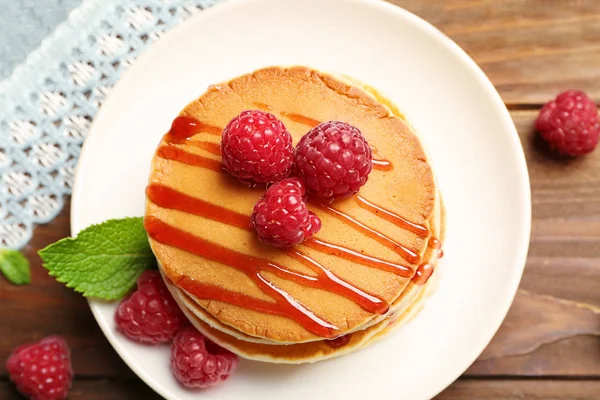 Plate with delicious pancakes on table — Stock Photo, Image