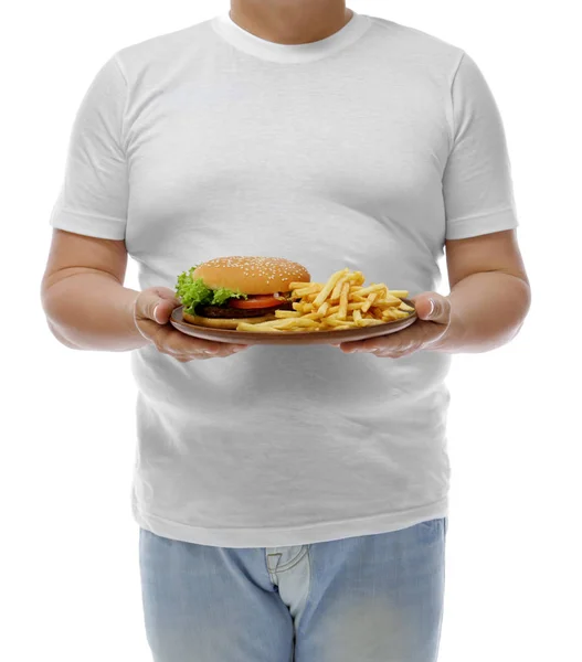 Man met plaat met junk food — Stockfoto
