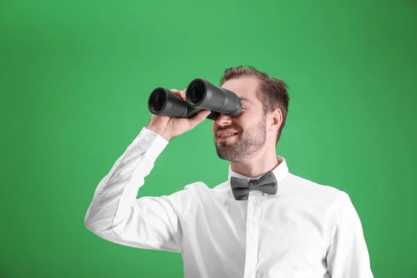 Handsome young man with binocular — Stock Photo, Image