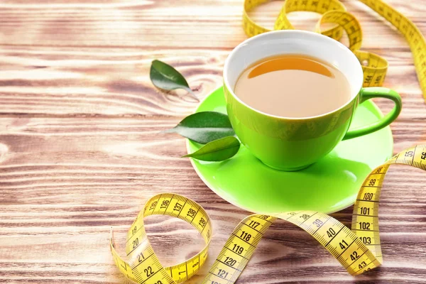 Xícara de chá e fita métrica — Fotografia de Stock