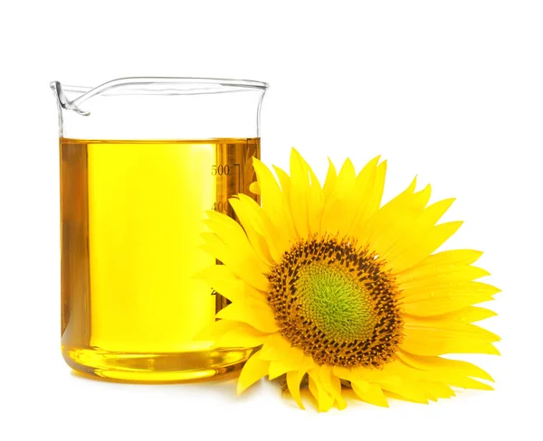 Beaker with cooking oil and sunflower — Stock Photo, Image