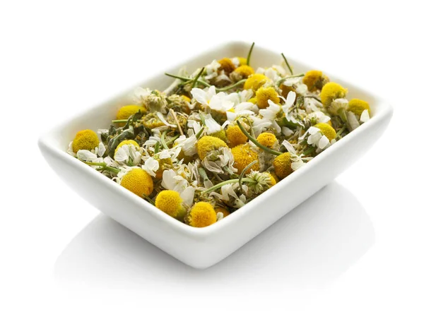 Bowl with dried chamomile flowers — Stock Photo, Image