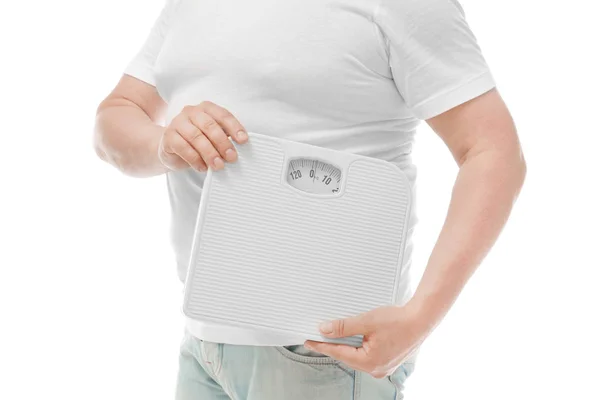 Overweight man holding weight scales on white background. Diet concept — Stock Photo, Image