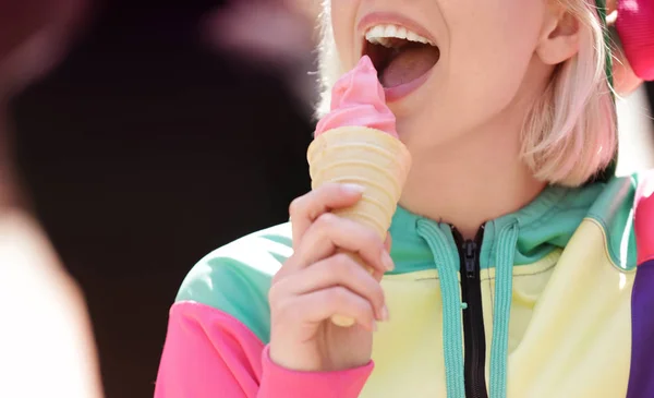 Young woman eating tasty ice cream — Stock Photo, Image