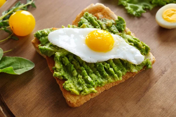 Tasty breakfast toast with avocado — Stock Photo, Image