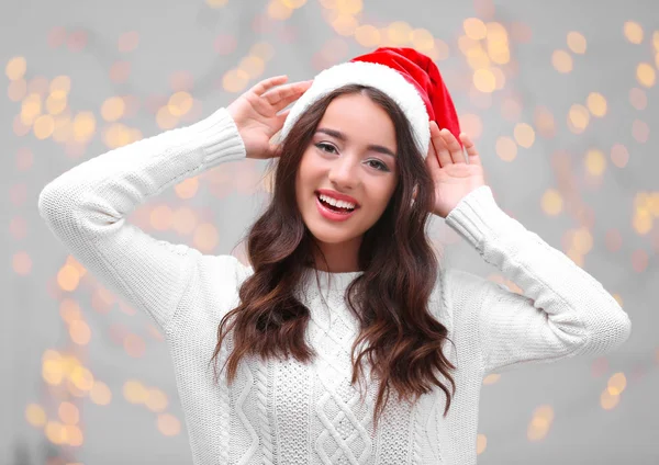 Pretty emotional lady in Christmas hat — Stock Photo, Image