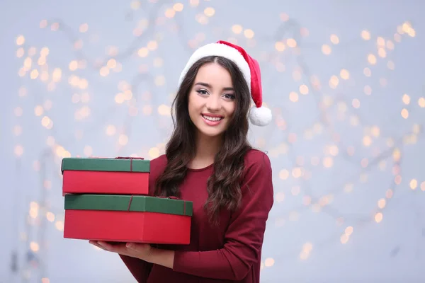 Young lady in Christmas hat — Stock Photo, Image