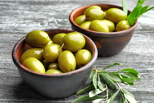 Bowls with tasty olives — Stock Photo, Image