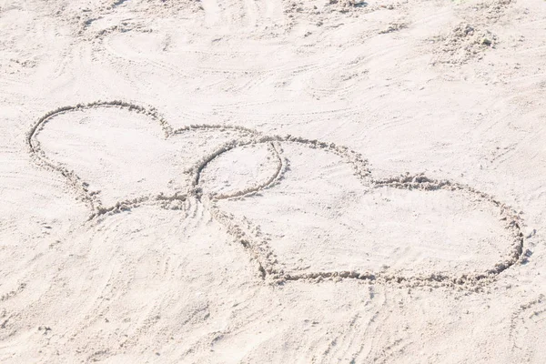 Drawing of hearts on sand. — Stock Photo, Image