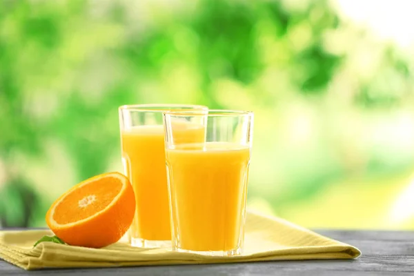 Glasses with delicious orange juice — Stock Photo, Image