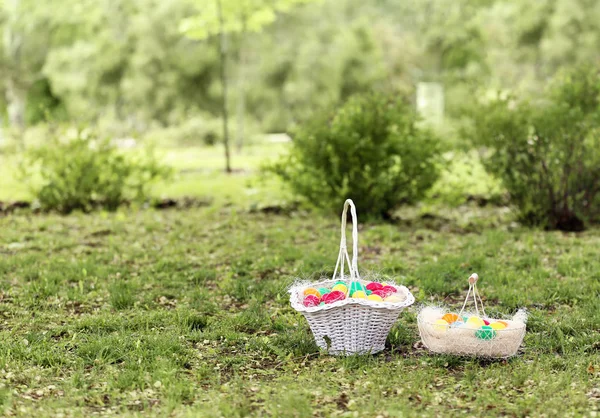 Baskets with colorful eggs — Stock Photo, Image