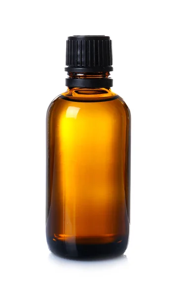 Glass bottle with essential cinnamon oil — Stock Photo, Image