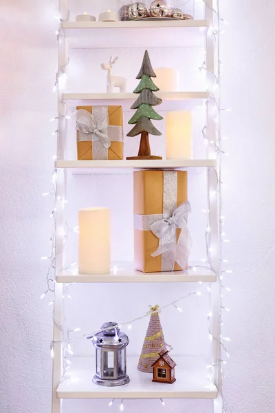 Shelves with decorations and Christmas lights — Stock Photo, Image