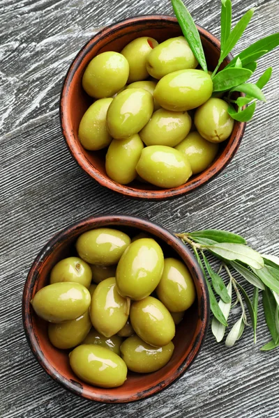Bowls with tasty olives — Stock Photo, Image