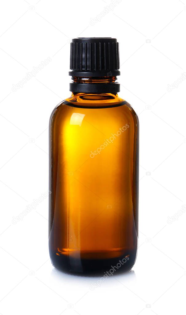 Glass bottle with essential cinnamon oil 