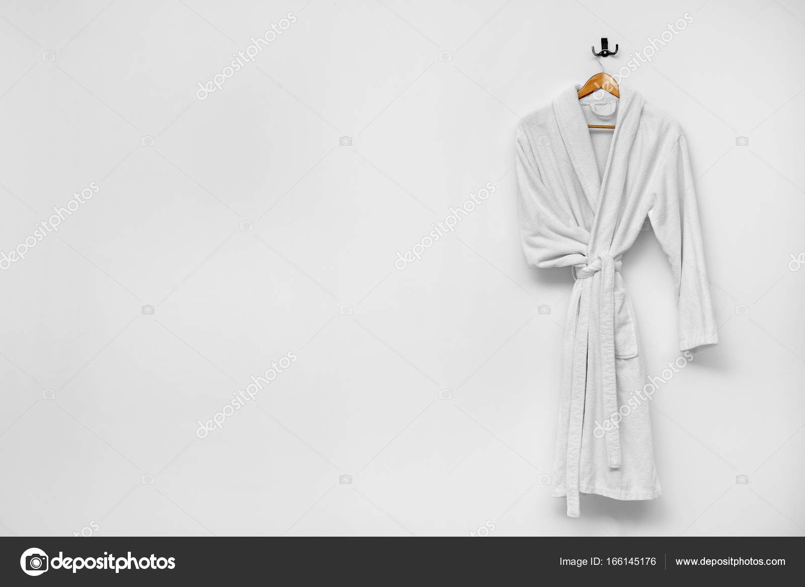 Download Bathrobe Hanging On White Wall Royalty Free Photo Stock Image By C Belchonock 166145176
