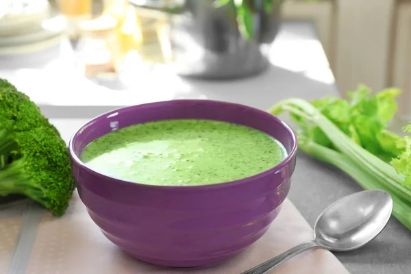 Purple bowl with delicious broccoli  soup — Stock Photo, Image